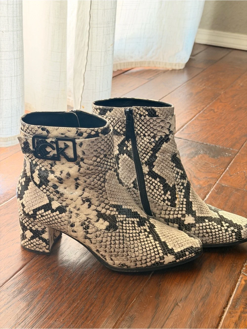 Calvin Klein Black & Ivory Snakeskin-Print Ankle Booties